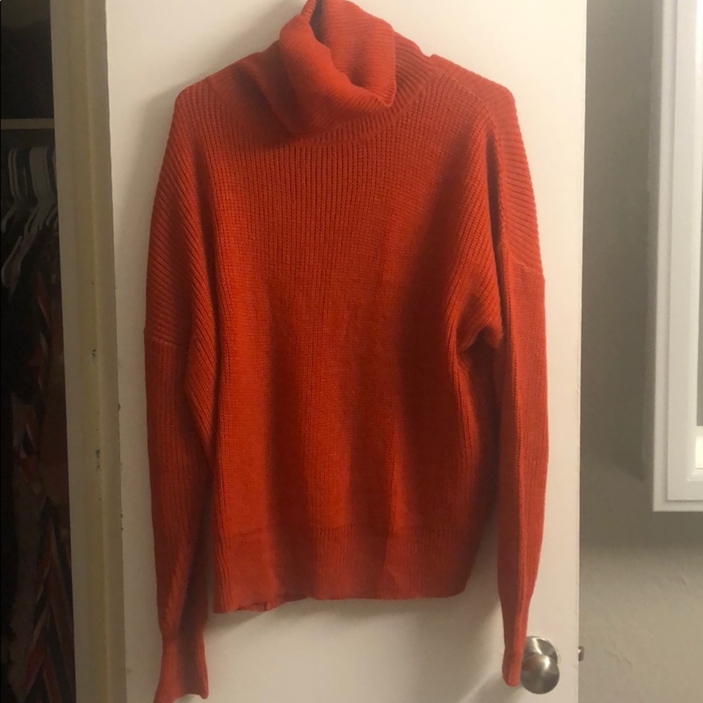 Size L orangey-red sweater